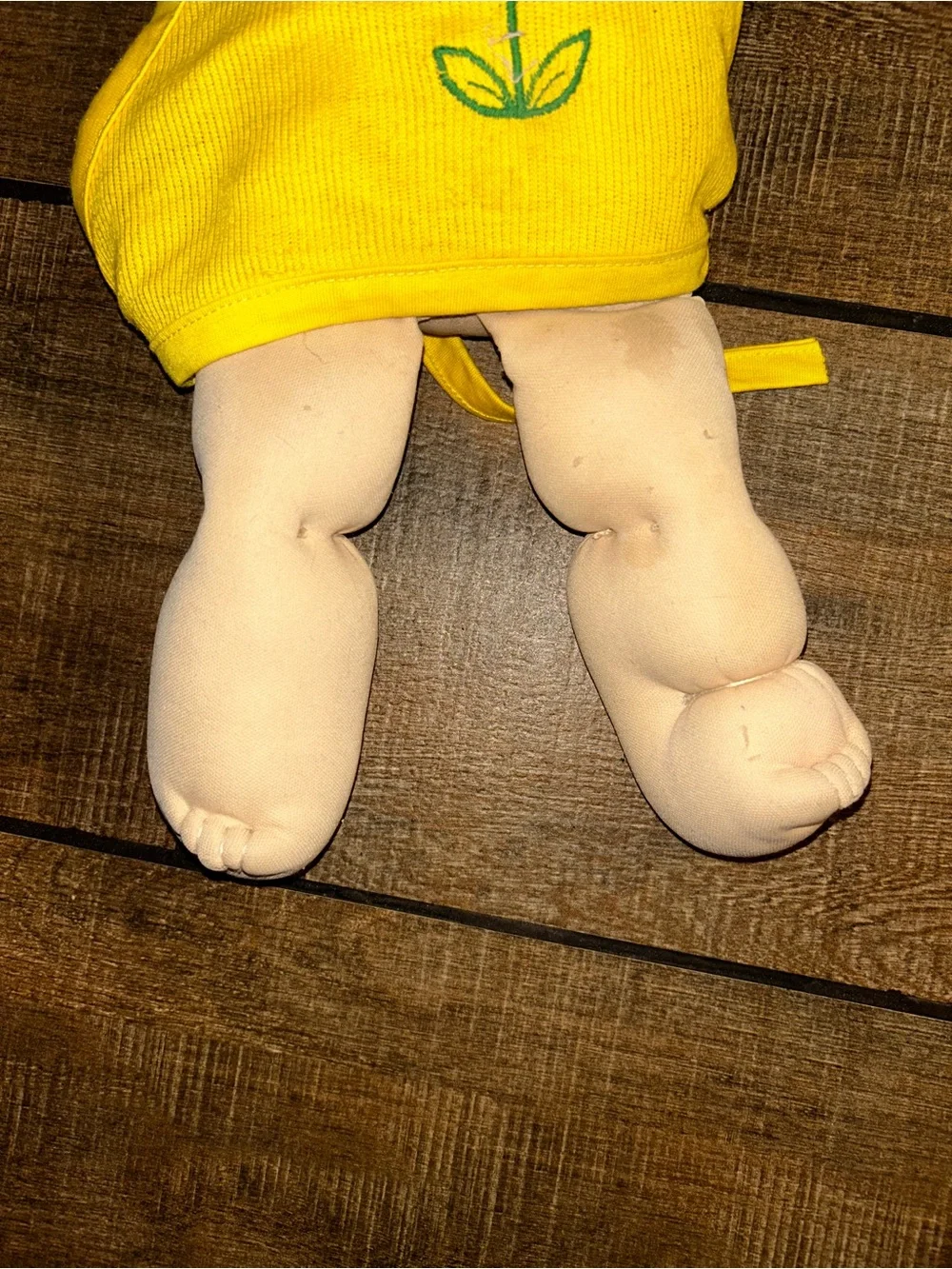 Vintage Cabbage Patch Kids soft-bodied doll with a vinyl head, brown yarn